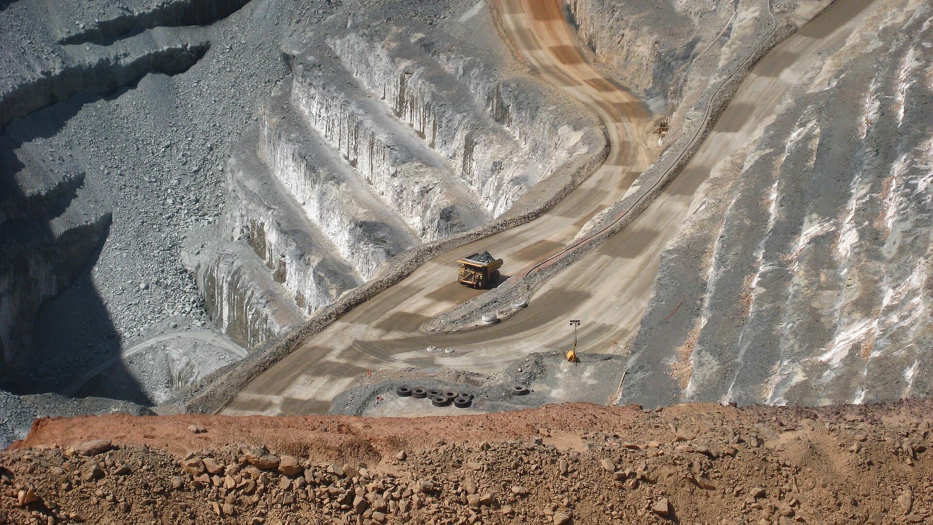 Mining truck on the benches of an open-pit gold mine